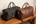Luxury duffle bags on a bench